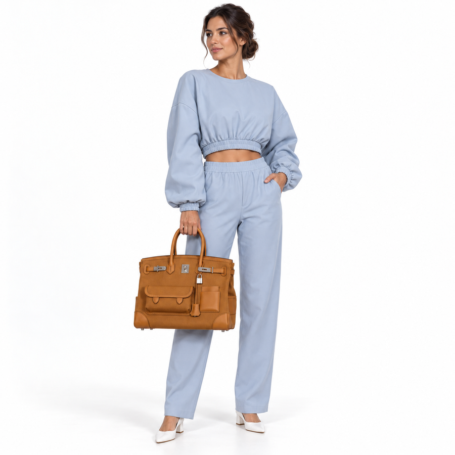 Hermès Birkin Cargo 35 Sesame Swift & Canvas Palladium Hardware shown on a human model in a white studio