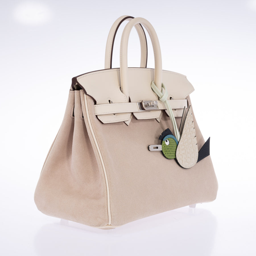 Hermès Birkin 25 Grizzly Glycine Doblis Suede Nata Swift Palladium Hardware, three-quarter view styled with an Hermès Birdy charm