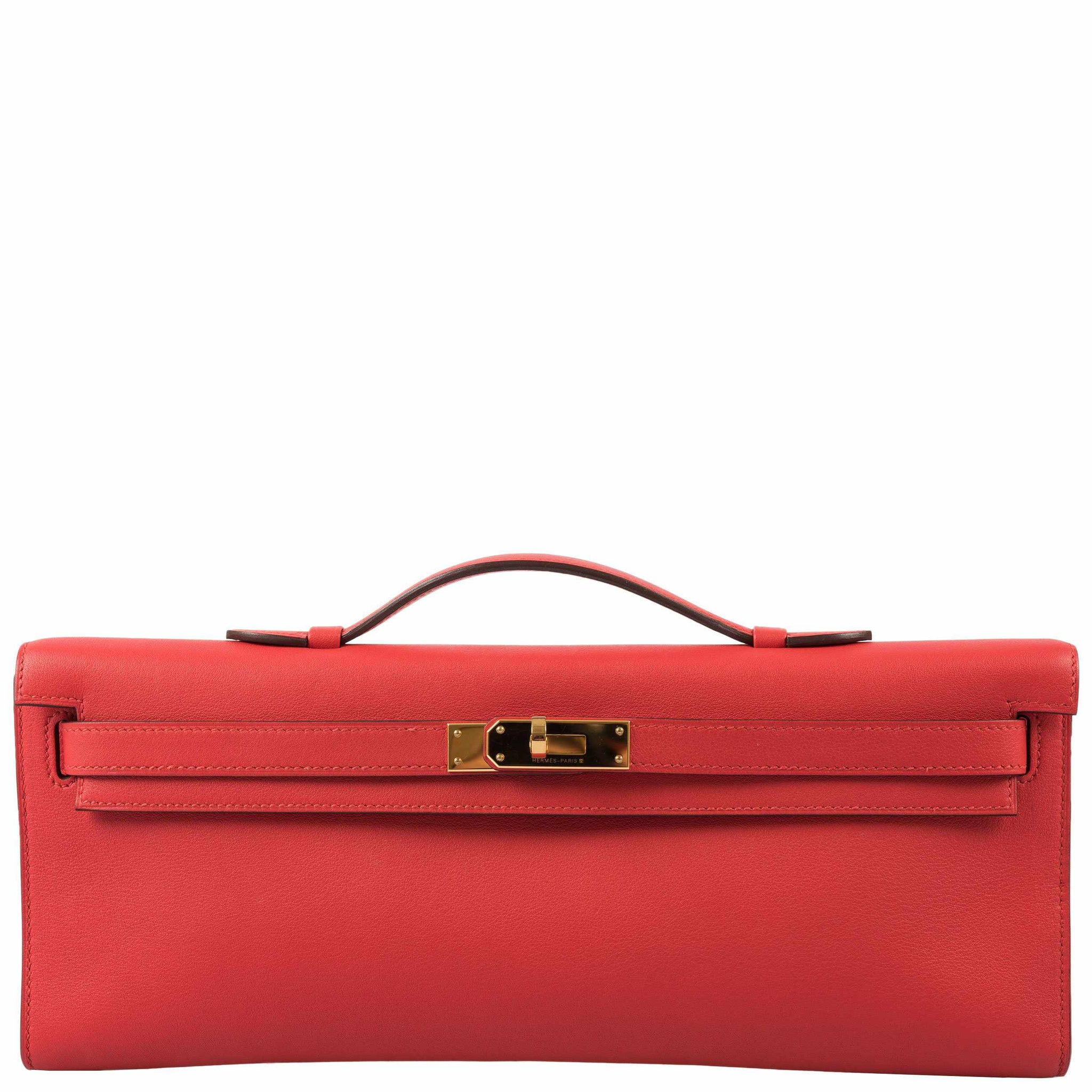 Kelly Pochette Our Price: $18800 CAD / $13800 USD Color: Rouge Tomate (Red)  Size: 8.75 x 5.25 x 2.75 Material: Swift Leather Hardware:…