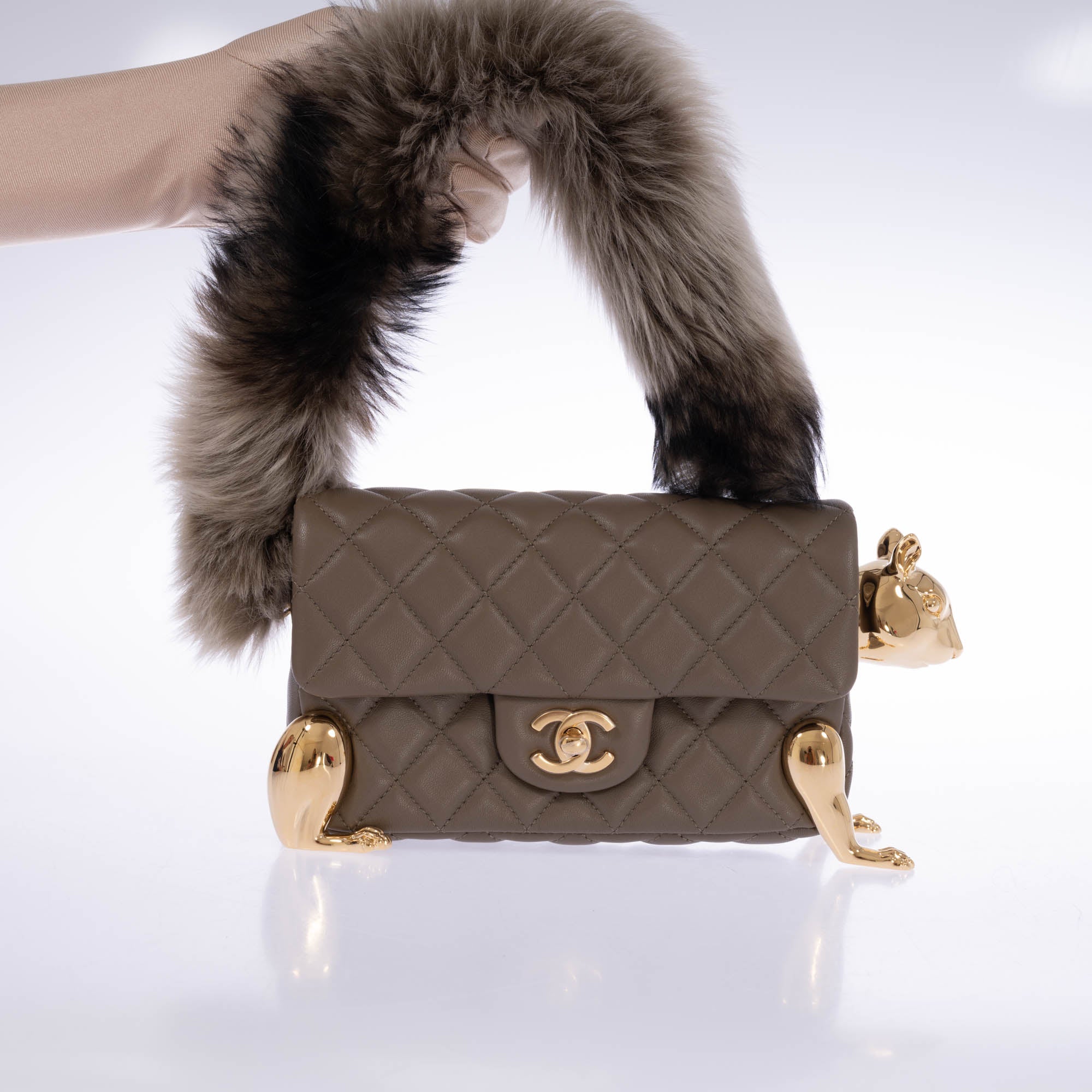 Chanel Squirrel Mini Flap Bag front with fur tail handle raised
