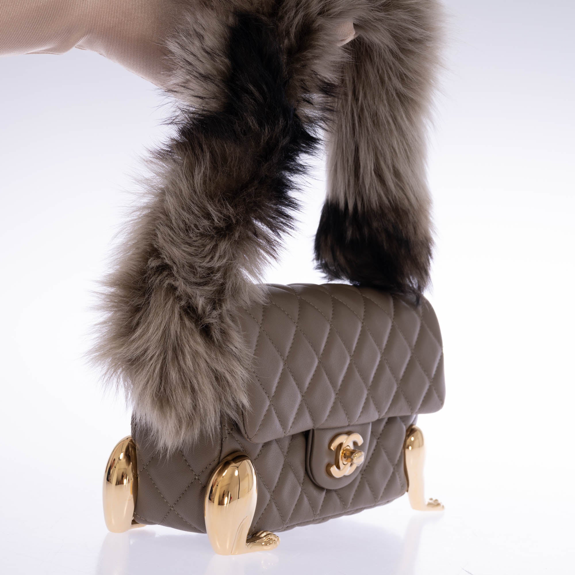 Chanel Squirrel Mini Flap Bag three quarter view gold legs