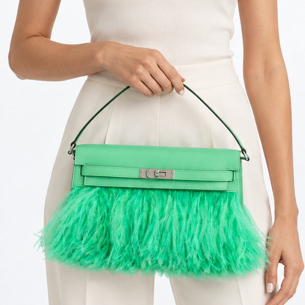 Hermès Kelly Élan Folie Vert Comics Chèvre Chamkila and ostrich feather bag with palladium hardware, front carry studio model view.