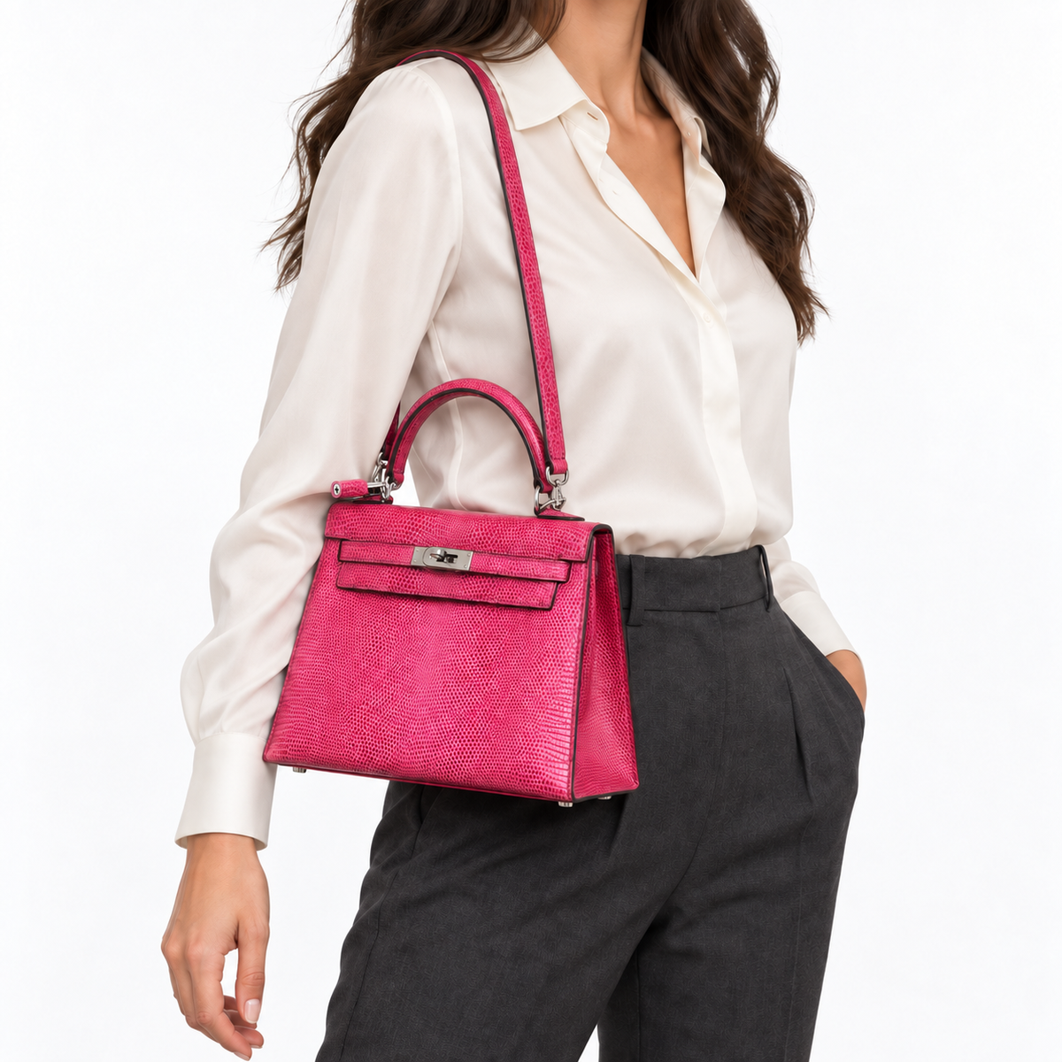 Hermès Kelly 25 Sellier in Fuchsia lizard with palladium hardware, worn on its matching lizard shoulder strap by a human model