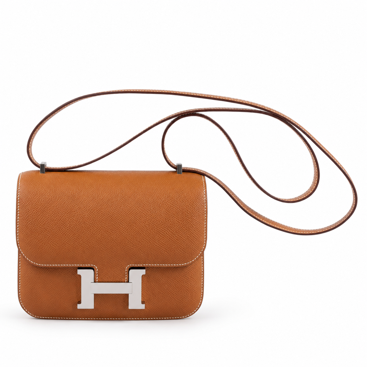 Hermès Constance 18 Mini III in Gold Epsom with palladium hardware, front product view with its leather strap on white and a soft contact shadow.