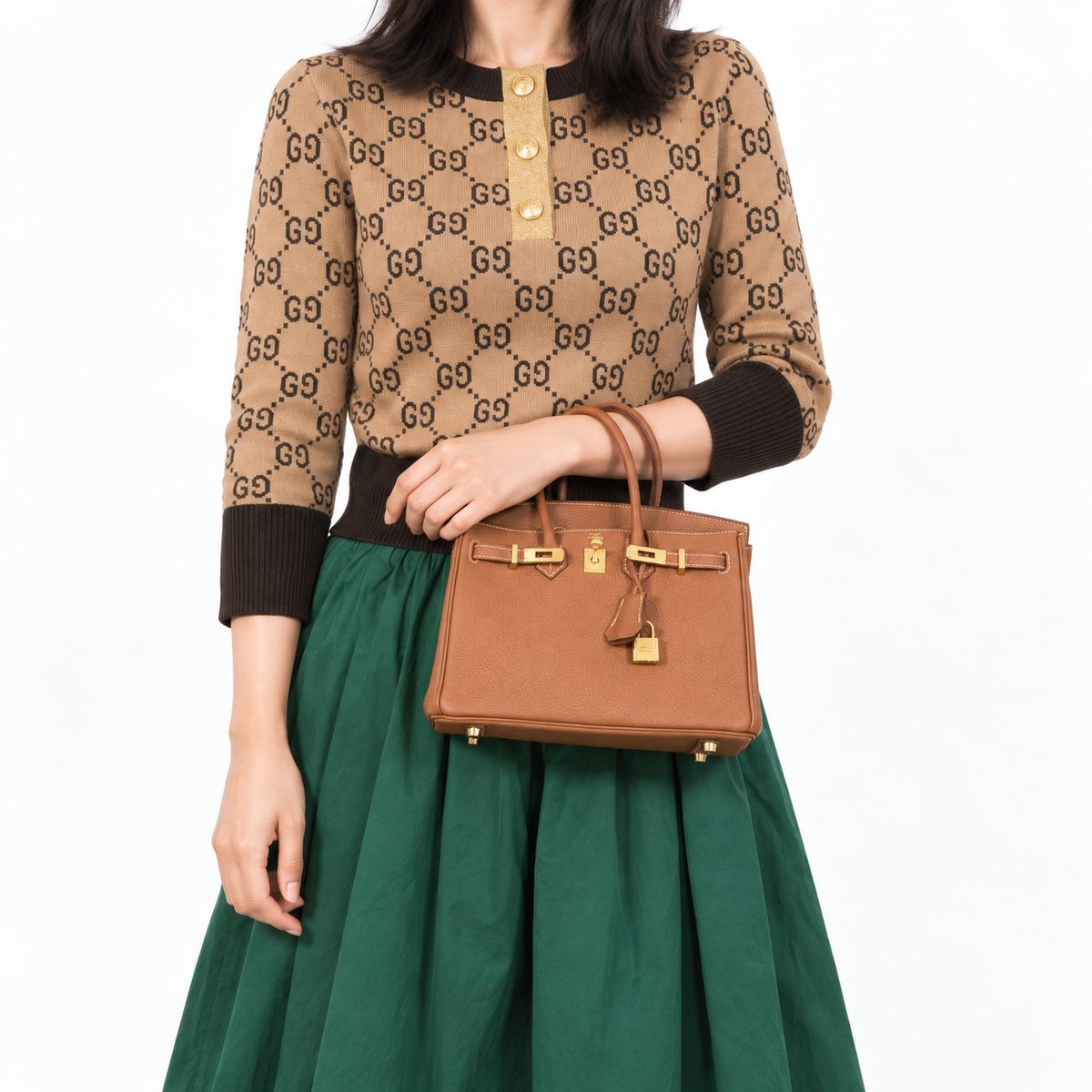 Hermès Birkin 25 Gold Togo with gold hardware, human model forearm-carry detail.