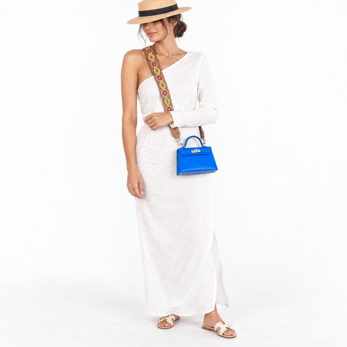 Hermès Kelly 20 Blue Hydra Chevre with palladium hardware worn by a model with patterned strap