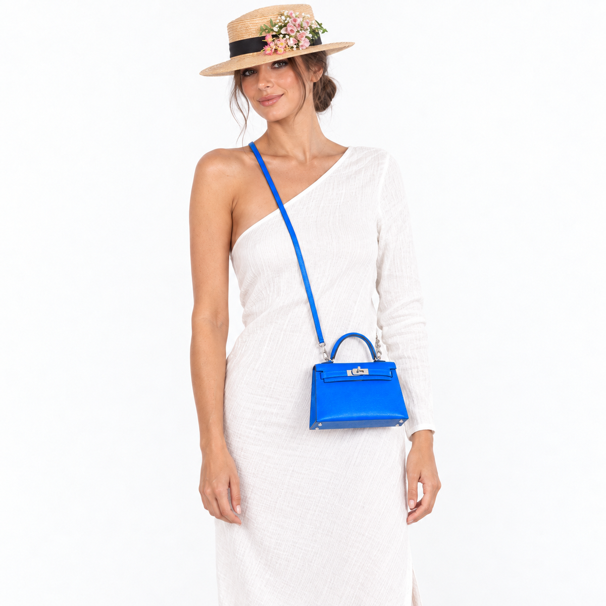 Hermès Kelly 20 Blue Hydra Chevre with palladium hardware worn by a model with blue strap