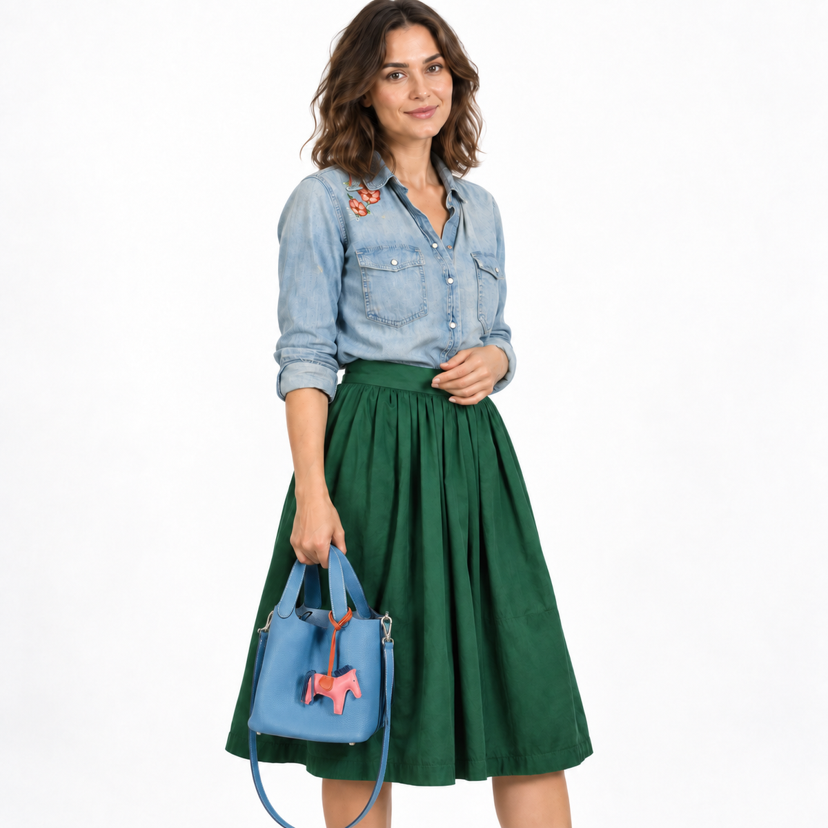 Hermès Picotin Lock PM Blue Jean Togo Palladium Hardware worn by a woman in a white studio