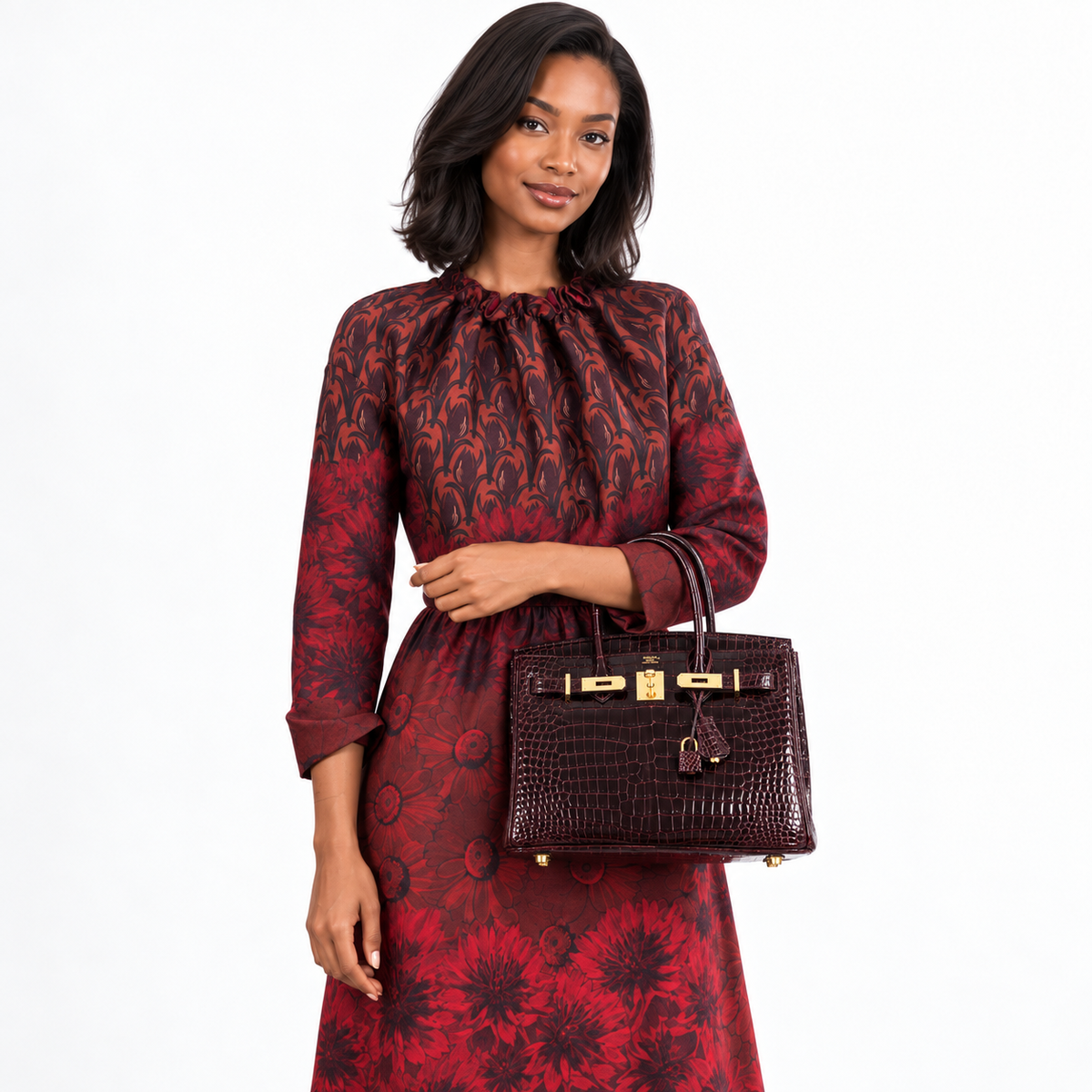 Hermès Birkin 30 Bordeaux Porosus Crocodile Gold Hardware carried by a human model on a white studio background.