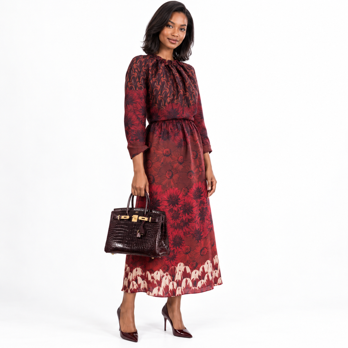 Hermès Birkin 30 Bordeaux Porosus Crocodile Gold Hardware carried by a human model on a white studio background.