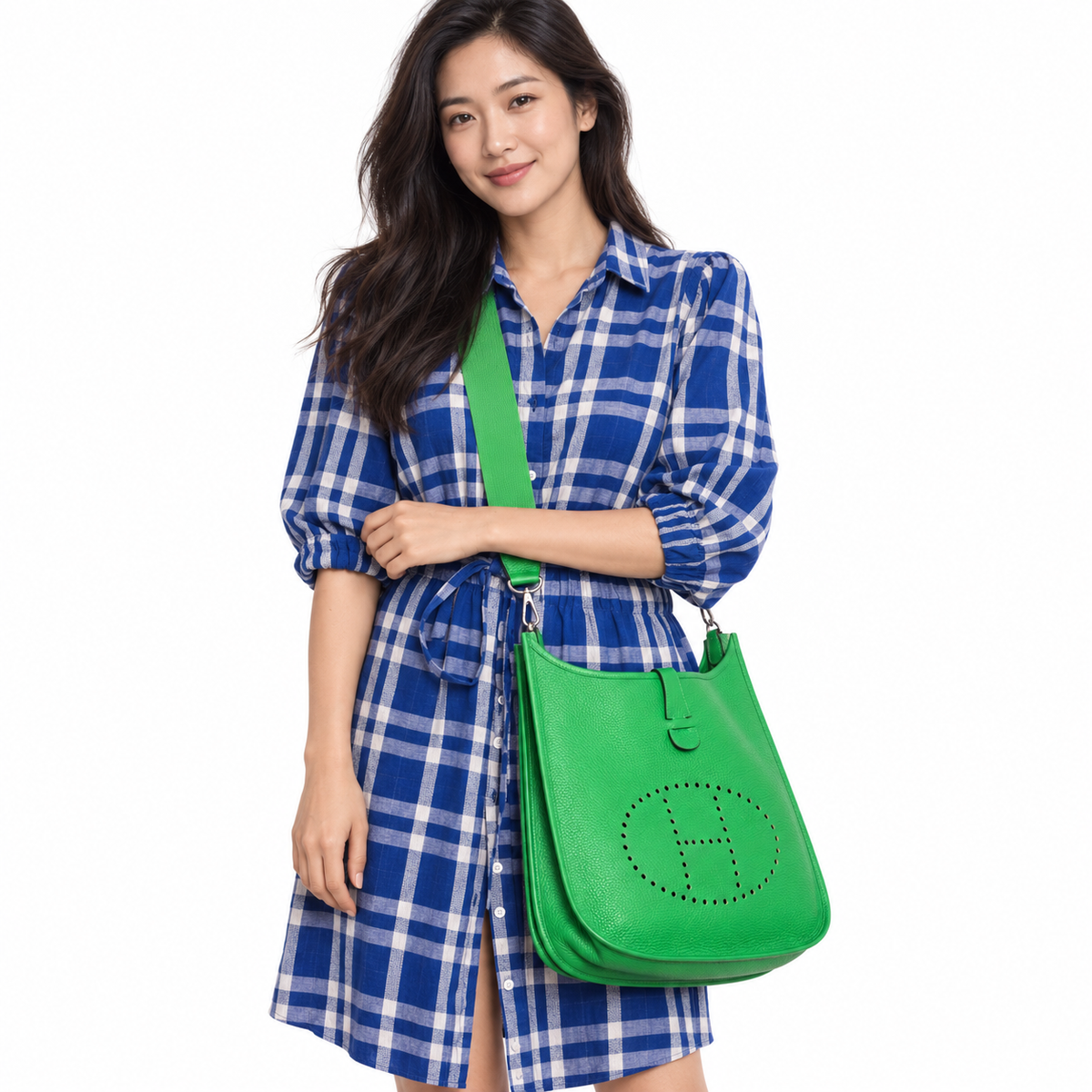 Hermès Evelyne Taurillon III GM Bambou Bamboo Clemence Palladium worn by a human model on a white studio background.