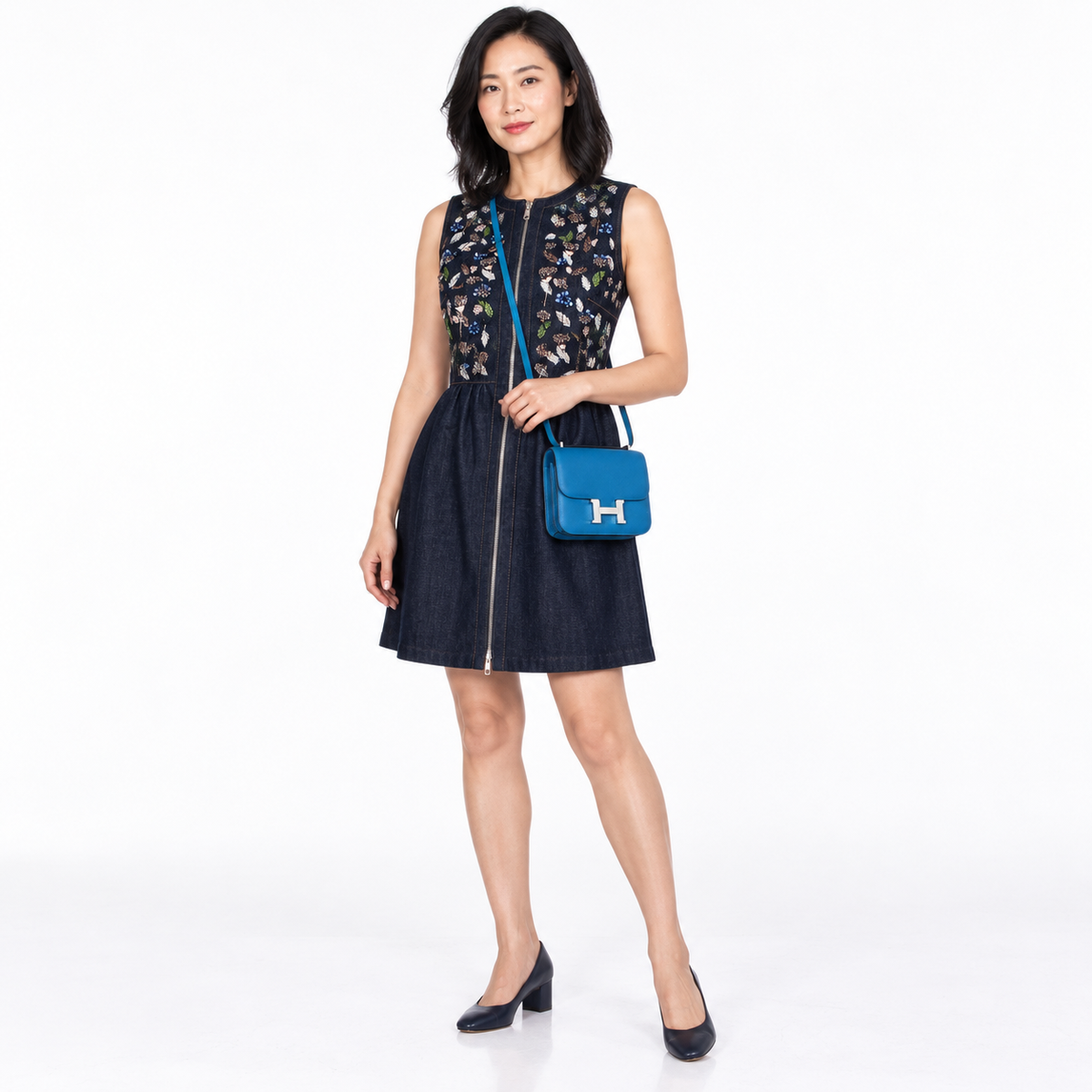 Hermès Constance 18 Blue Izmir Epsom with palladium hardware worn by a model