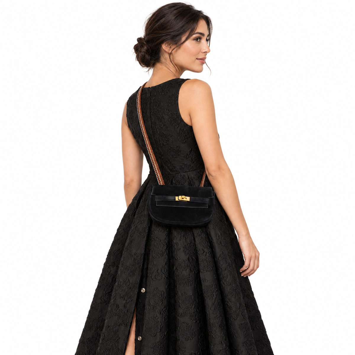 Hermès Kelly Banana 20 Black Suede Waist Pochette Gold Hardware worn by an adult model in a white studio