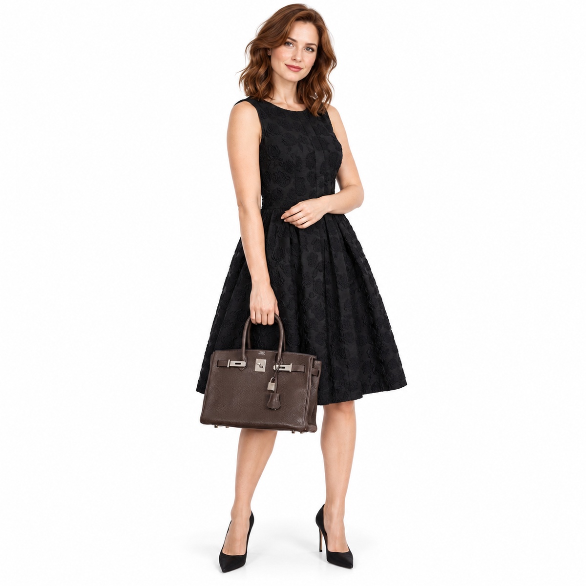 Hermès Birkin 30 Chocolat Clemence Palladium Hardware worn by an adult model in a white studio