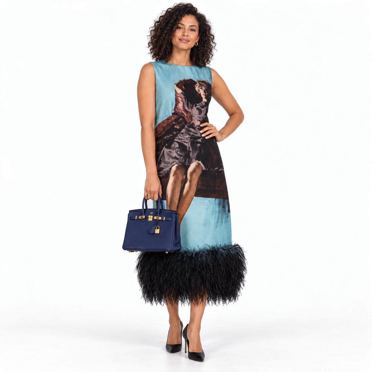 Hermès Birkin 25 Blue Encre Togo with gold hardware carried by a model