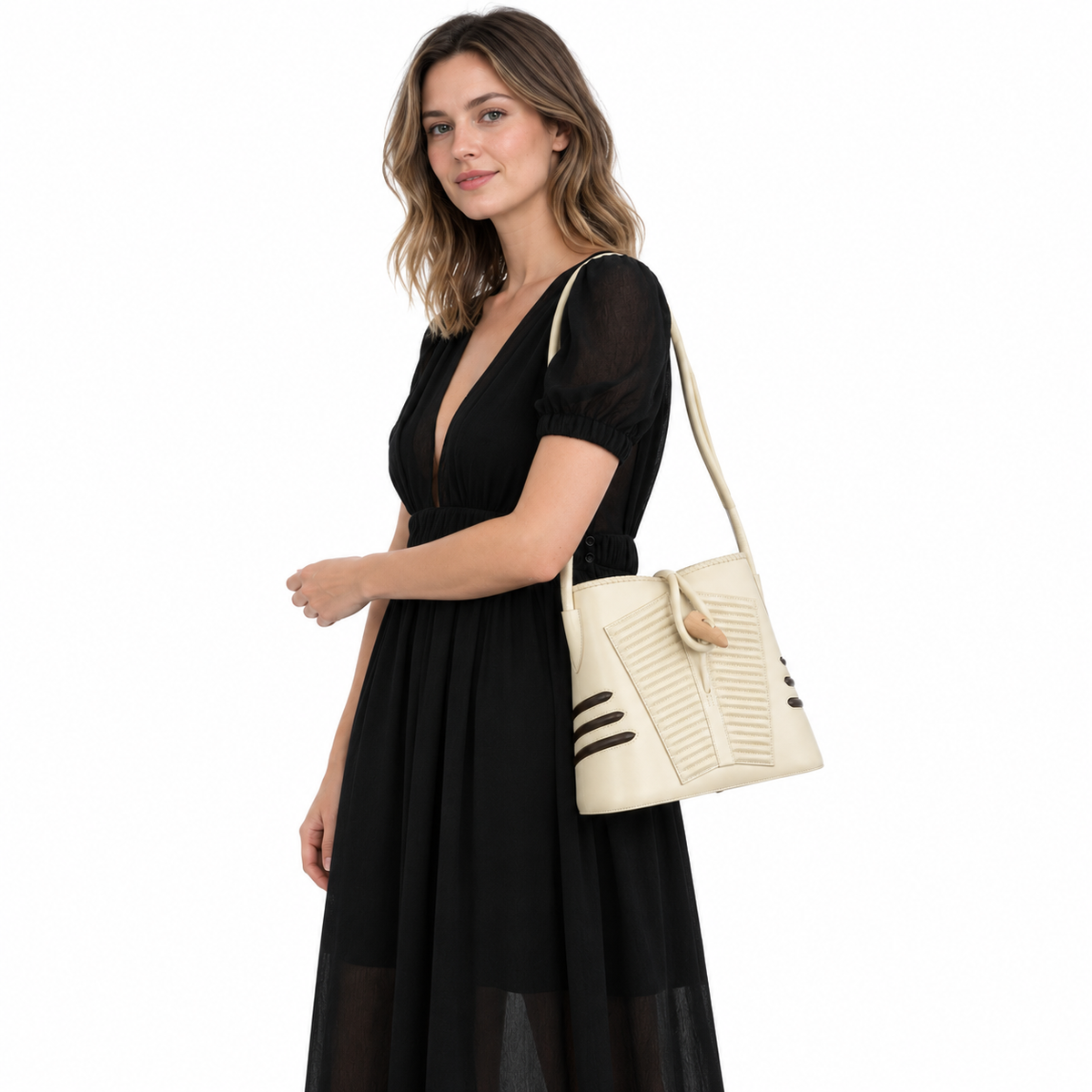 Hermès Shogun Blanc Casse Box & Marron Fonce Chèvre “Sac Vader” Tote worn by an adult model in a white studio