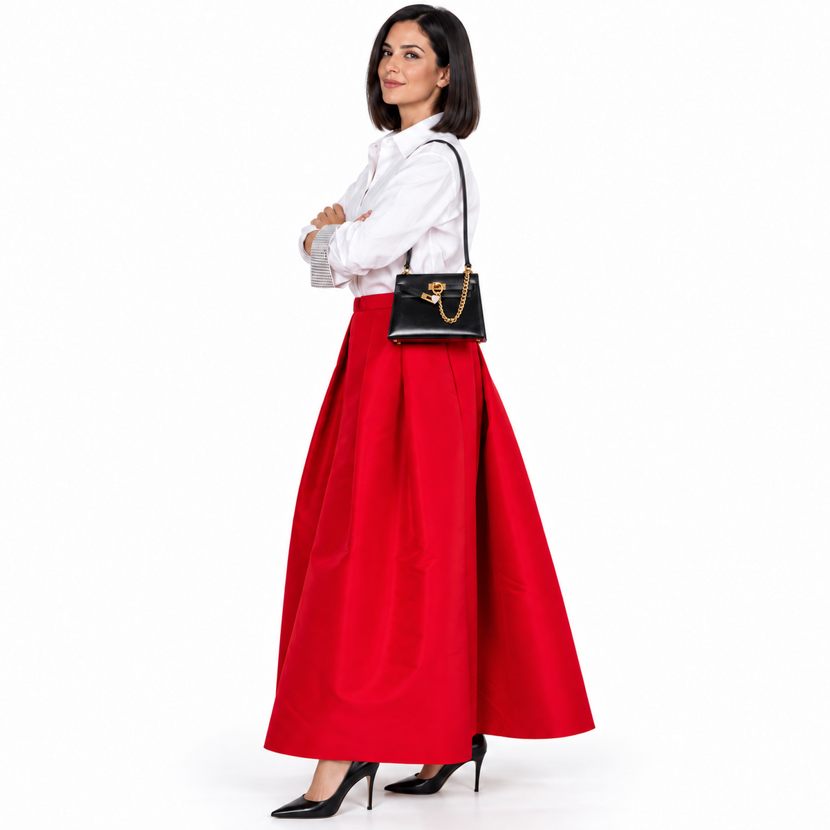 Hermès Kelly 20 Mini Sellier Vintage Black Box Leather with Gold Hardware on a model in a white studio