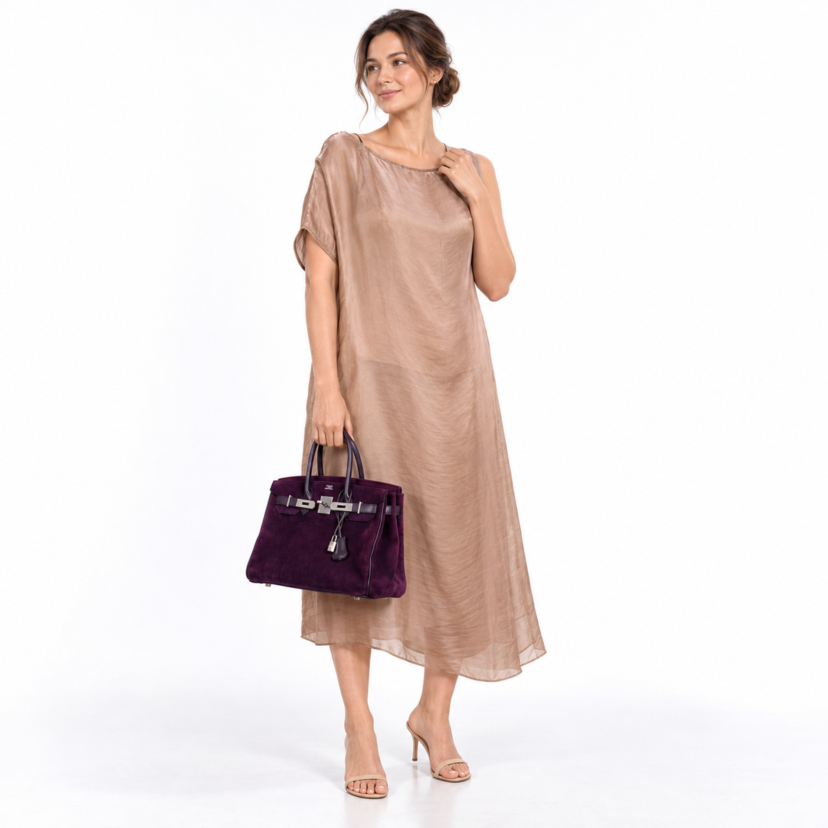 Hermès Birkin 30 Raisin suede and Swift with palladium hardware carried by a model