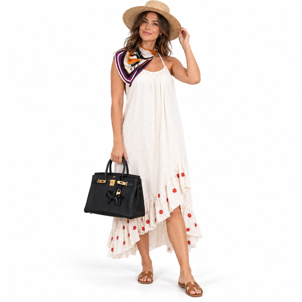 Hermès Birkin 30 Black Togo with gold hardware carried by a model