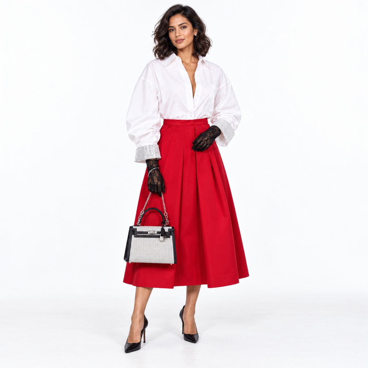 Hermès Kelly 25 Quadrille black and white Viking Toile and Swift with palladium hardware and a silver wrist chain carried by a woman in a red skirt