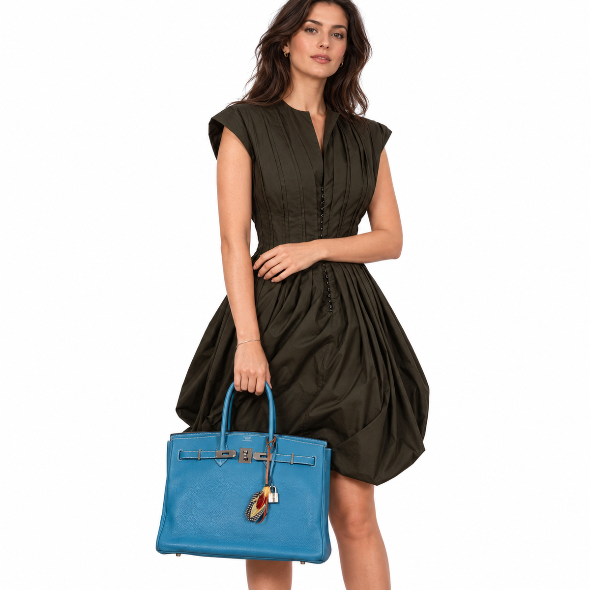 Hermès Birkin 35 Blue Jean Togo with Palladium Hardware worn by a model in a white studio