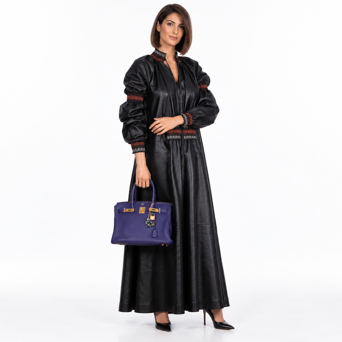 Hermès Birkin 30 Iris Togo with Gold Hardware worn by a model in a white studio