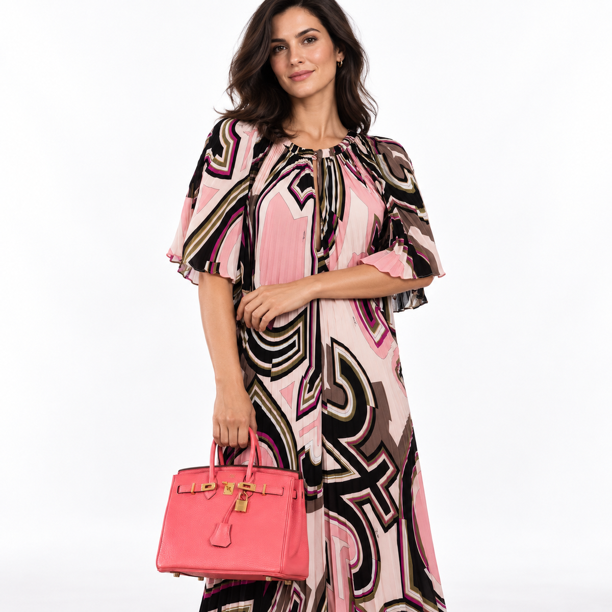 Hermès Birkin 25 Rose Lipstick Togo Gold Hardware shown on a model in a white studio, hand carry