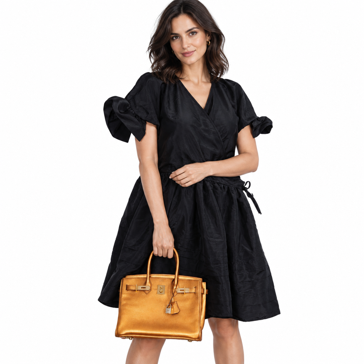 Hermès Birkin 30 Metallic Bronze Chevre Gold Hardware on an adult model in a white studio