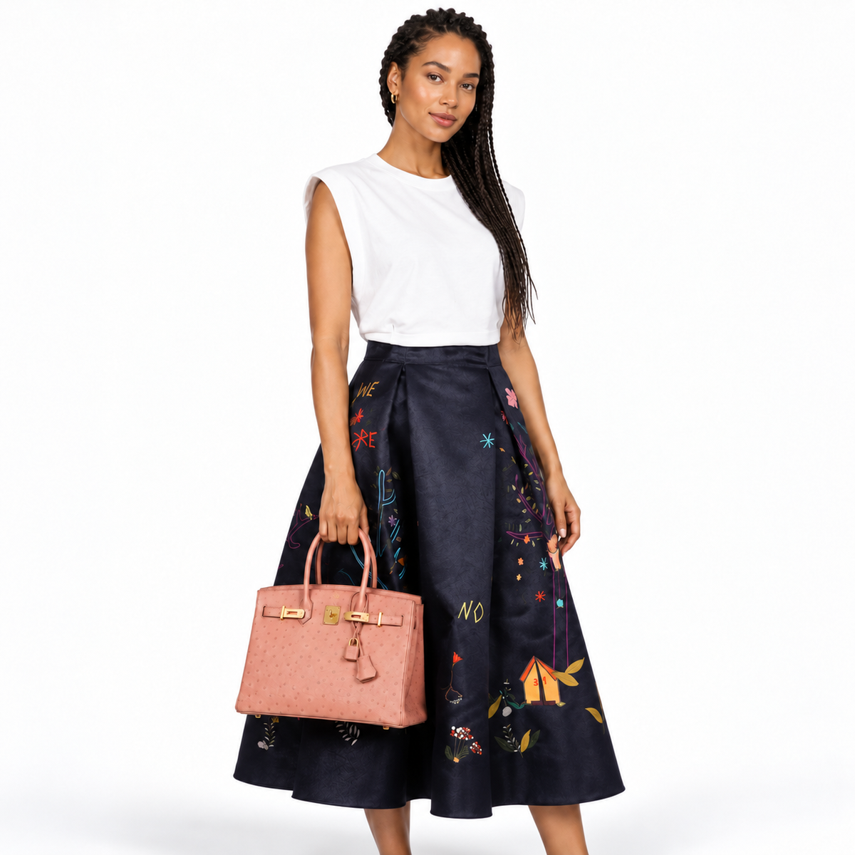 Hermès Birkin 30 Terre Cuite ostrich gold hardware carried by a model on white