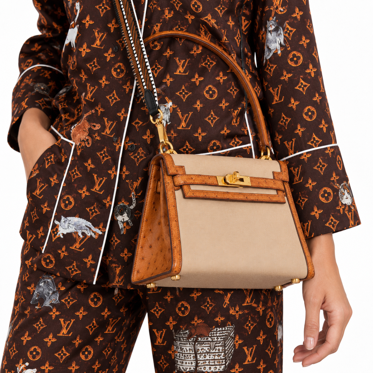 Hermès Kelly 20 Sellier Gold Ostrich & Natural Toile Gold Hardware - Vintage on an adult model in a white studio — carry detail