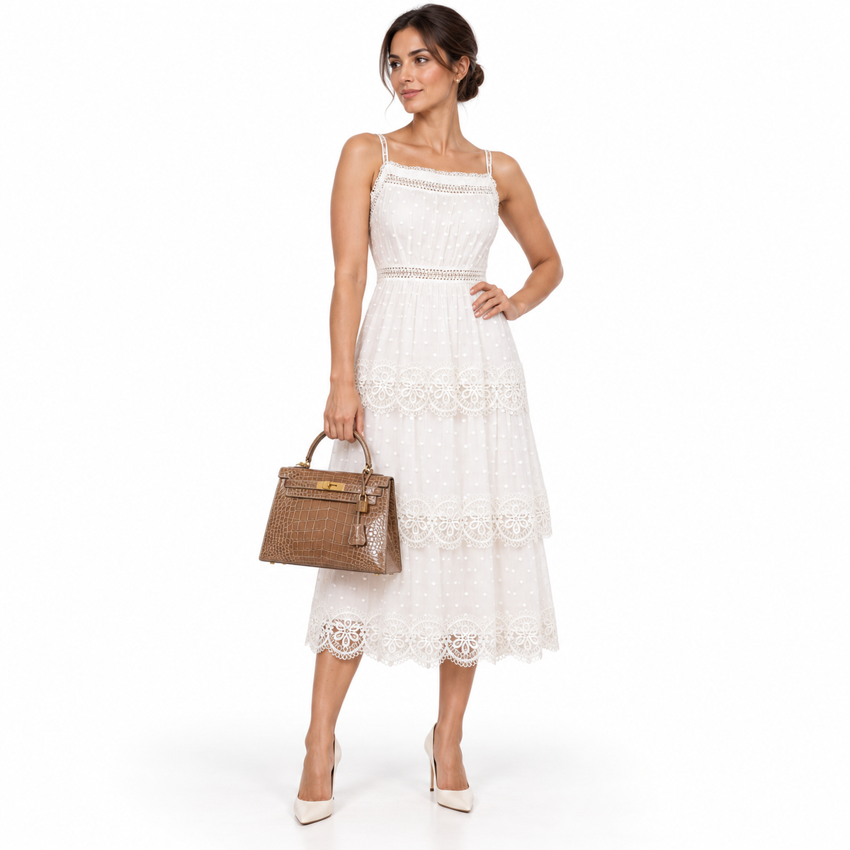 Hermès Kelly 28 Sellier Ficelle Alligator with Gold Hardware shown on a human model in a white studio