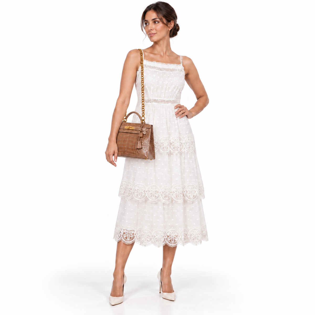 Hermès Kelly 28 Sellier Ficelle Alligator with Gold Hardware shown on a human model in a white studio