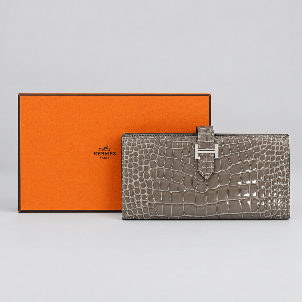 Hermès Béarn Soufflet Gris Ciment Shiny Alligator Palladium Hardware, front view beside its Hermès box