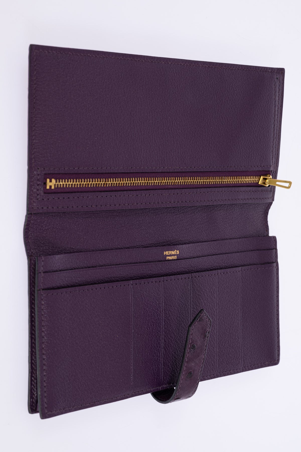 Hermès Béarn Wallet Violine Ostrich Gold Hardware, open, showing the card slots, flat pockets and zipped coin compartment