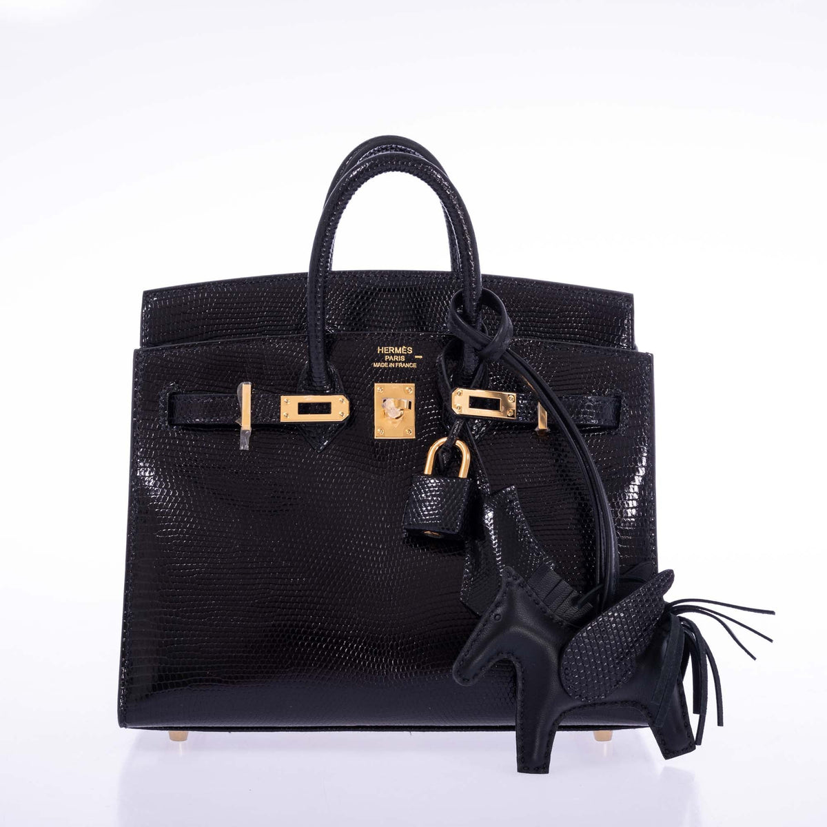 Hermès Birkin 20 Sellier Noir Shiny Varanus Niloticus Lizard Gold Hardware, front view, styled with a Rodeo charm, not included