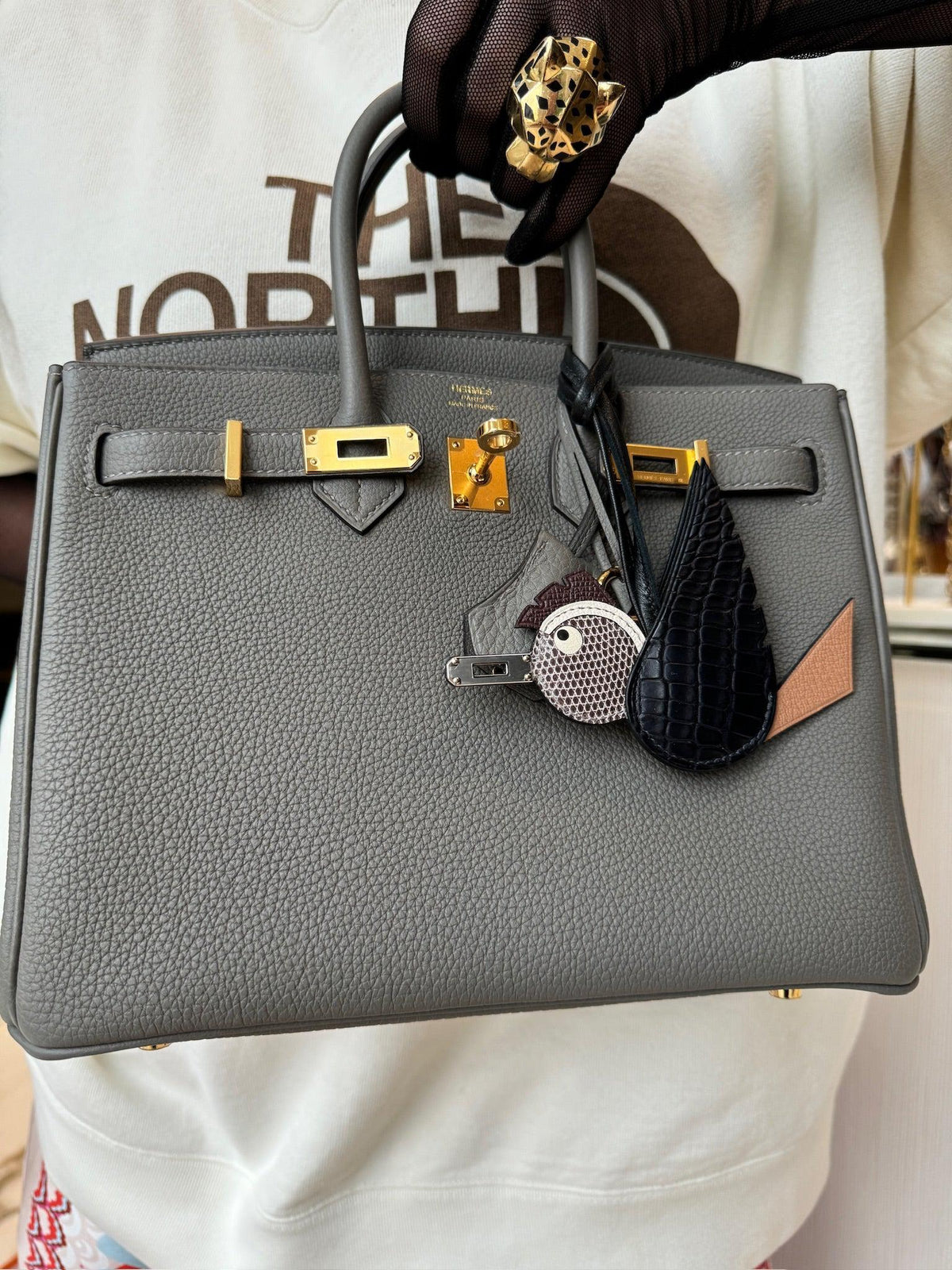 Hermès Birkin 25 Étain Togo Gold Hardware carried, styled with charms sold separately