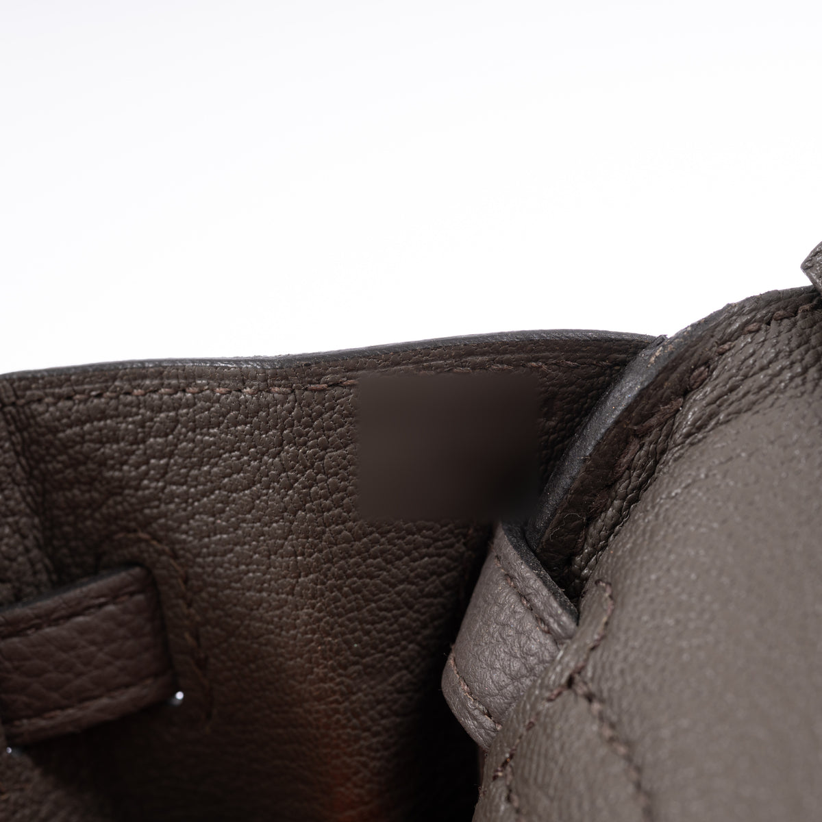 Hermès Birkin 25 Étain Togo Palladium Hardware, close-up of the interior leather and stitching.