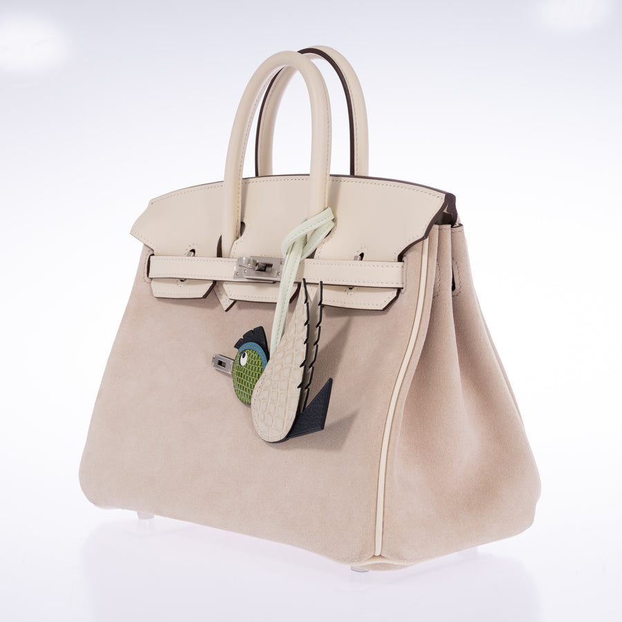 Hermès Birkin 25 Grizzly Glycine Doblis Suede Nata Swift Palladium Hardware, opposite three-quarter view styled with an Hermès Birdy charm