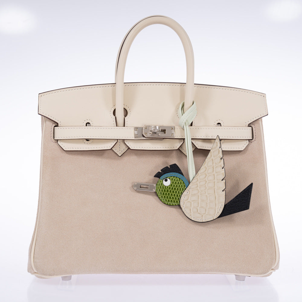 Béton, Noir and Pelouse Birdy charm attached to a closed Hermès Birkin 25 Grizzly Nata with palladium hardware.