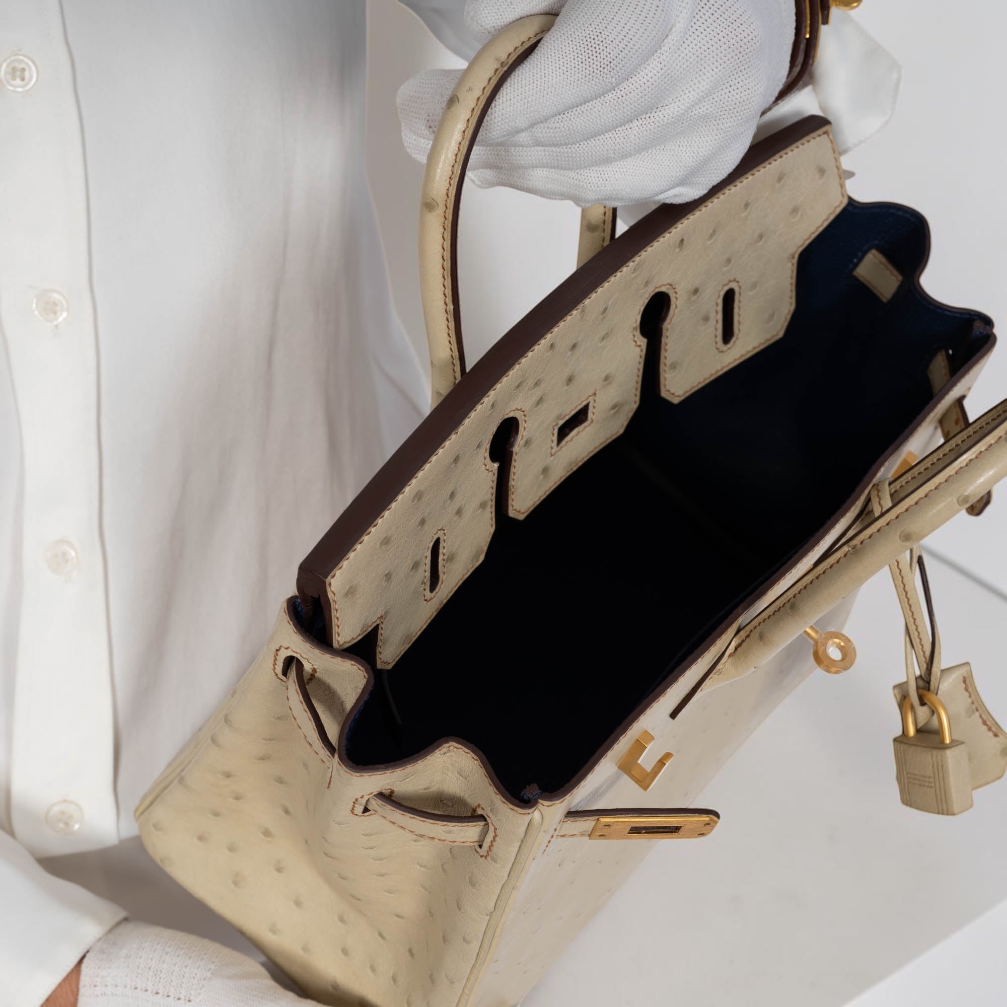 Hermès Birkin 25 HSS Nata Ostrich held open, showing the Bleu Saphir interior