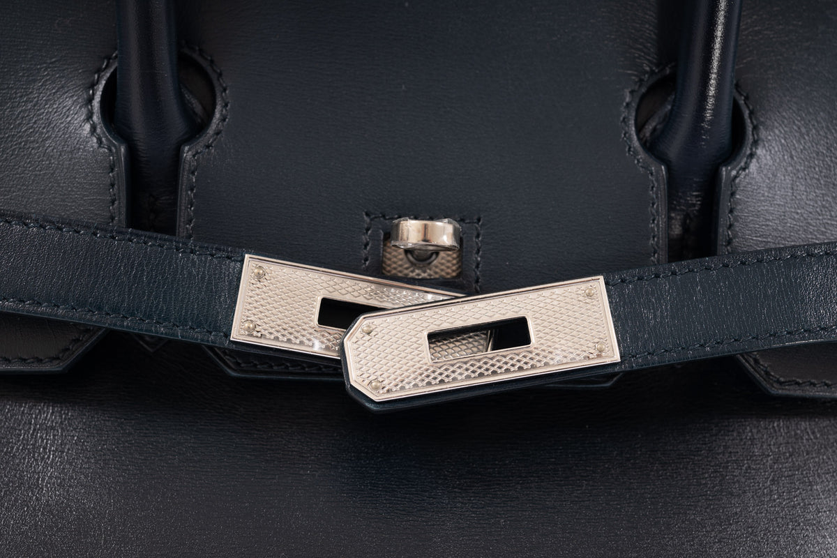 Hermès Birkin 30 Bleu de Prusse Box Calf Guilloche Palladium Hardware, close view of the guilloche turn-lock and strap plates