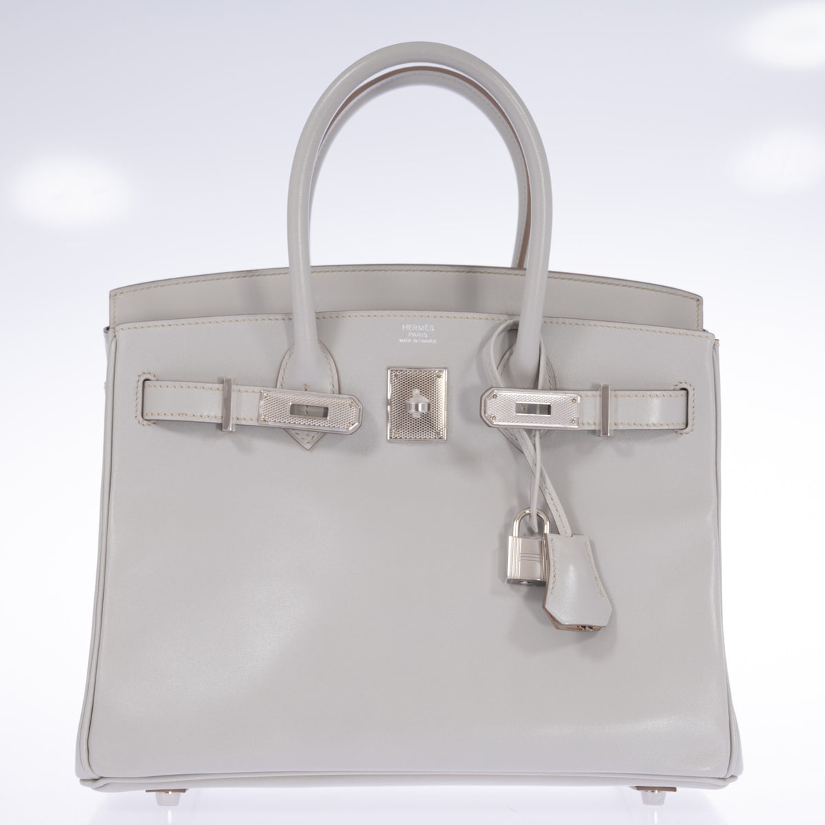 Hermès Birkin 30 Gris Perle Box Calf Guilloche Palladium Hardware, front view with the flap open and the straps unfastened, showing the HERMÈS PARIS MADE IN FRANCE heat stamp and protective plastic on the guilloche hardware