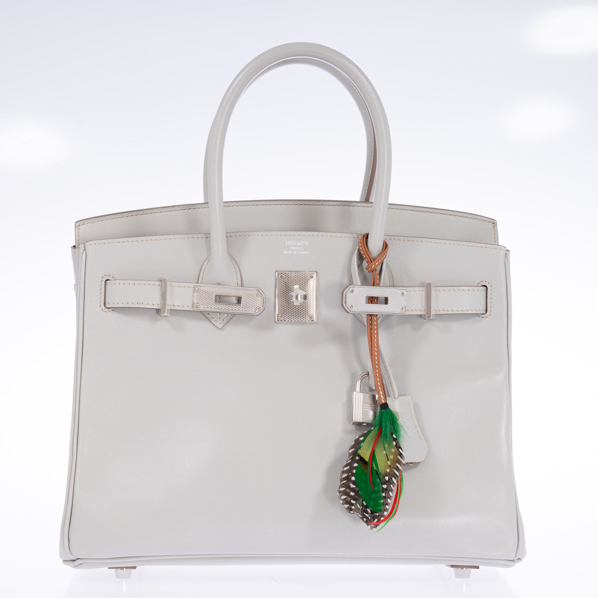 Hermès Birkin 30 Gris Perle Box Calf Guilloche Palladium Hardware, front view with the flap open, styled with a feather charm, sold separately