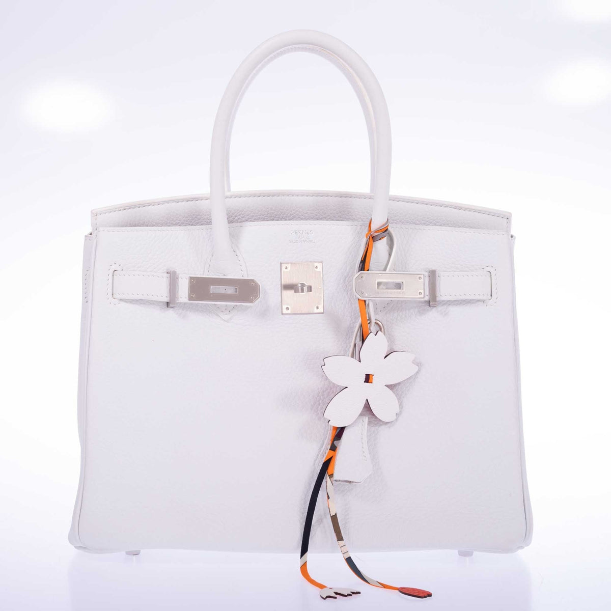 Hermès Birkin 30 HSS Blanc Clémence Brushed Palladium Hardware, front view without the padlock, shown with a flower charm and a twilly that are not included