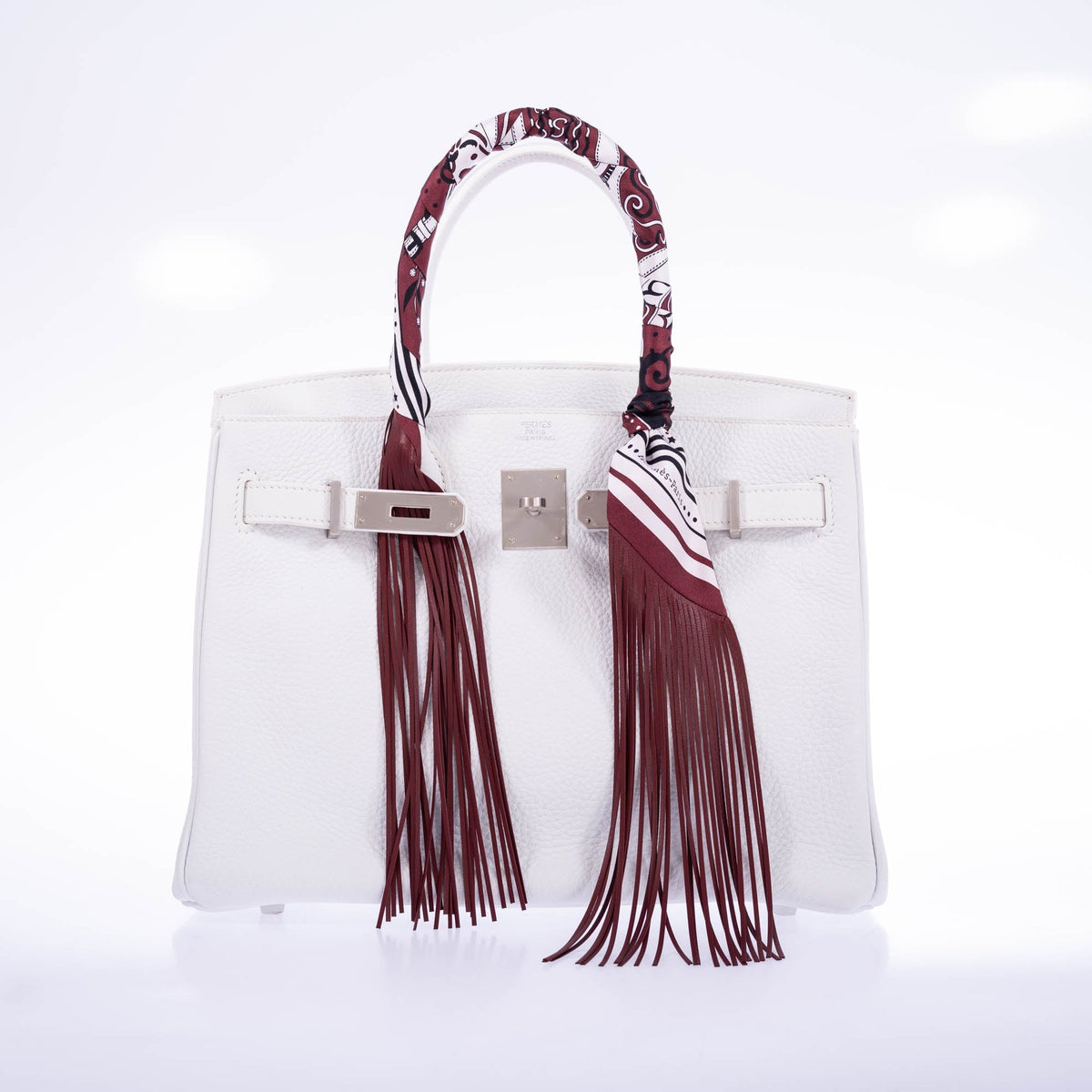 Hermès Birkin 30 HSS White Clemence Brushed Palladium Hardware, front view with the flap open, shown with fringed twillies that are not included