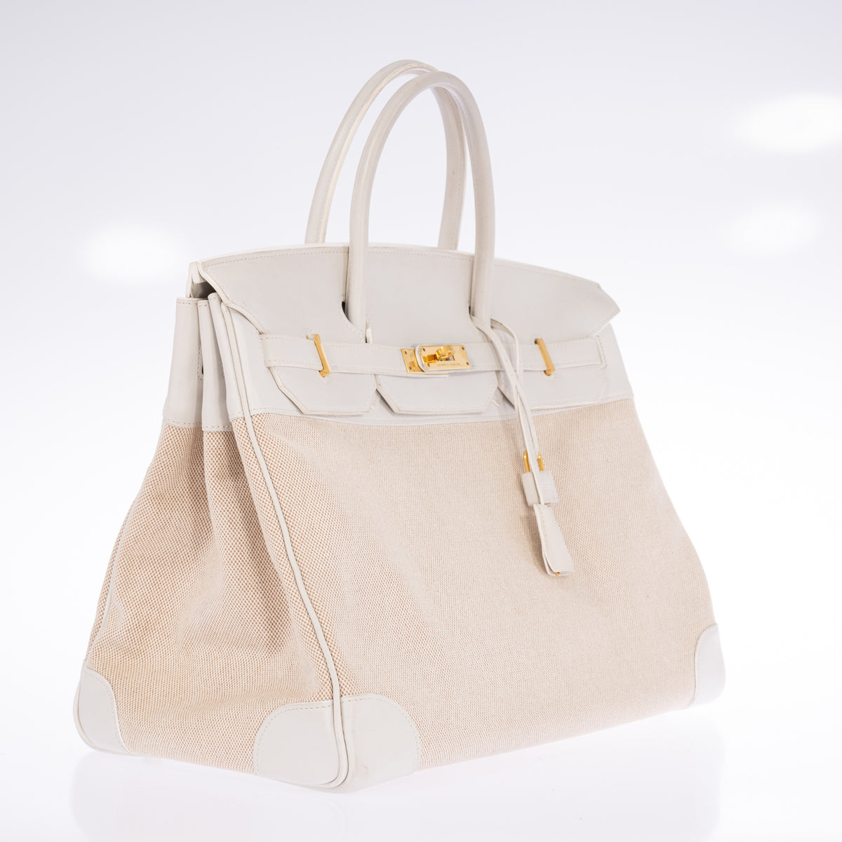 Hermès Birkin 40 Toile and Blanc Swift Gold Hardware, three-quarter view from the left