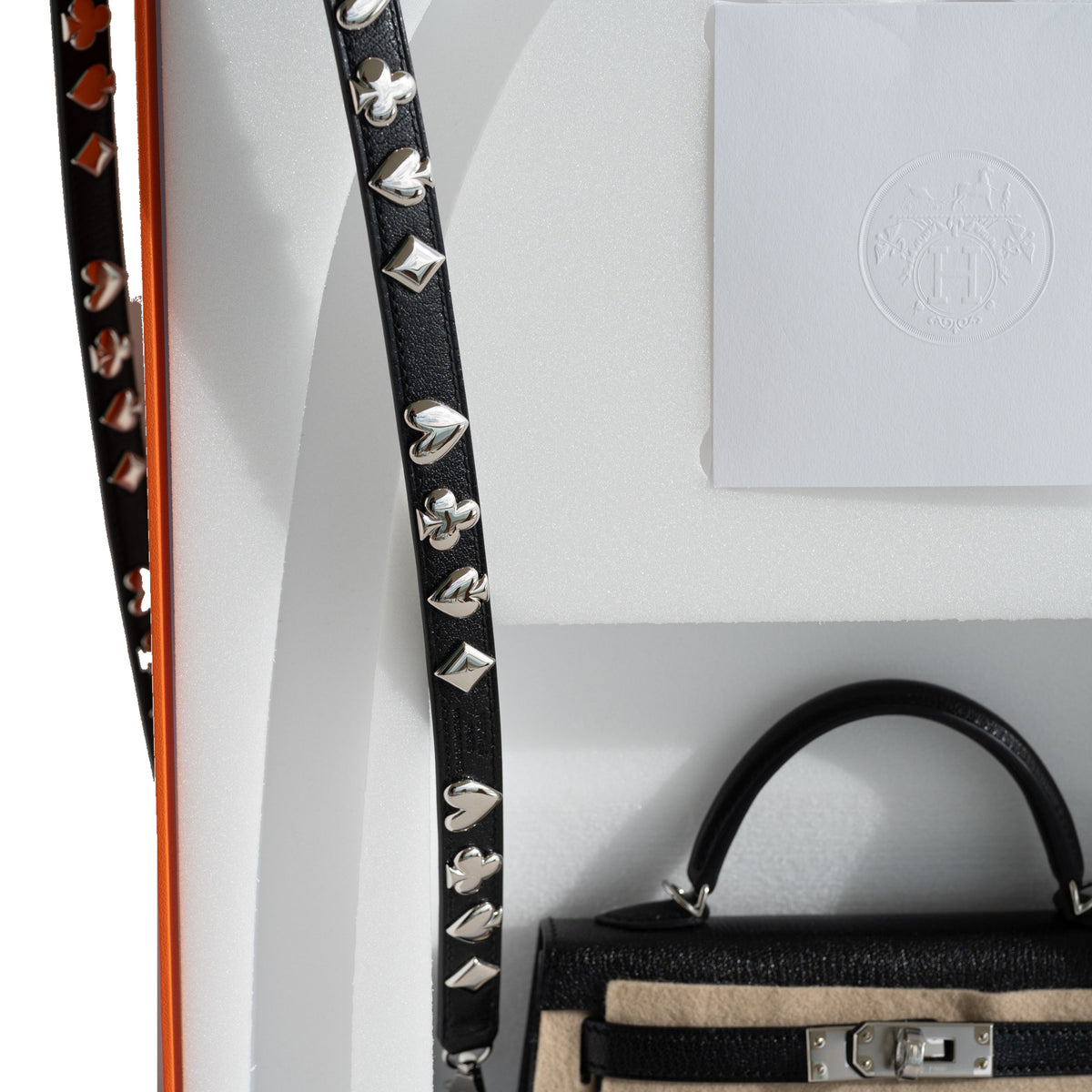 Hermès Clou de Coeur Kelly 20 Mini II Sellier Noir Chèvre Chamkila Palladium Hardware, card-suit studs on the shoulder strap with the Hermès packaging
