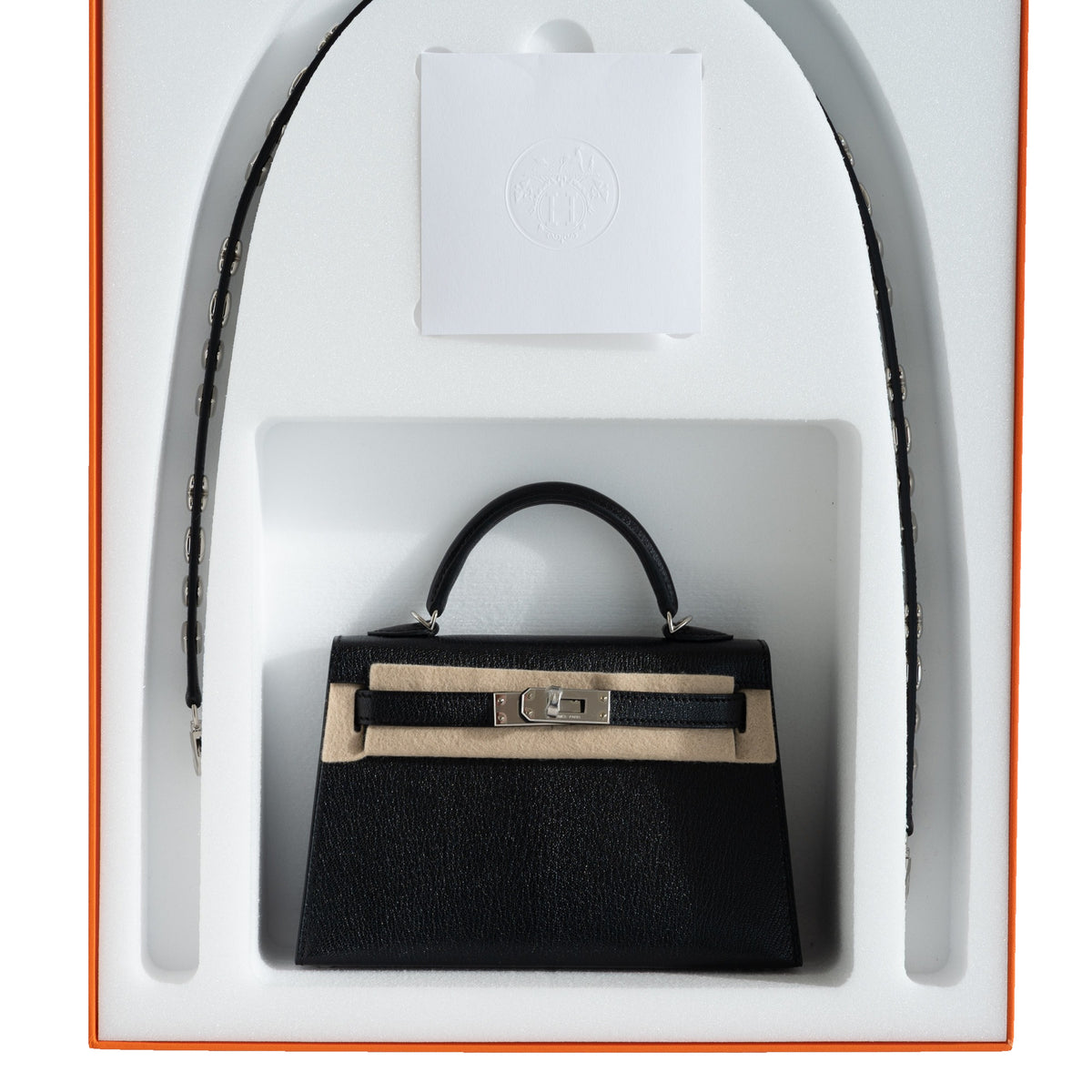 Hermès Clou de Coeur Kelly 20 Mini II Sellier Noir Chèvre Chamkila Palladium Hardware, in its Hermès box with the strap