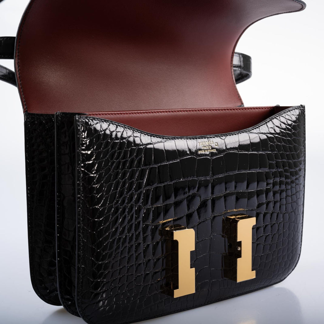 Hermès Constance 24 Verso Shiny Black Alligator and Rouge H with Gold Hardware