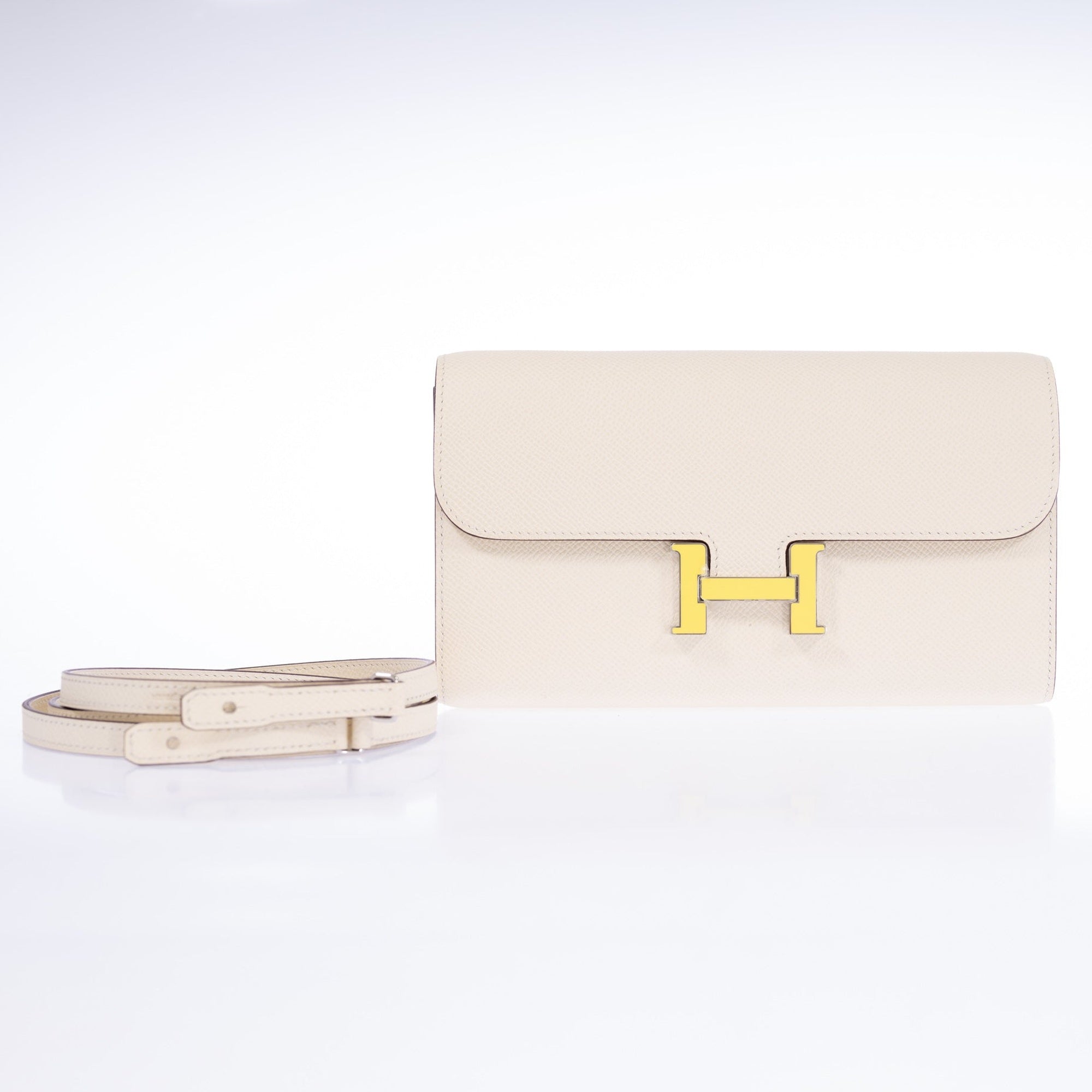 Hermès Constance Long To Go Wallet Nata with Jaune Citron Enamel Buckle, front view with detachable strap